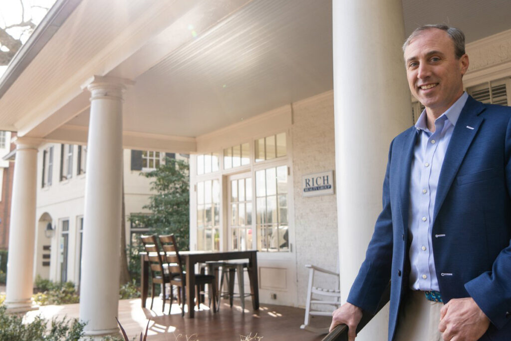 Marshall Rich stands in front of Rich Realty Group's offices in Five Points, Raleigh, NC