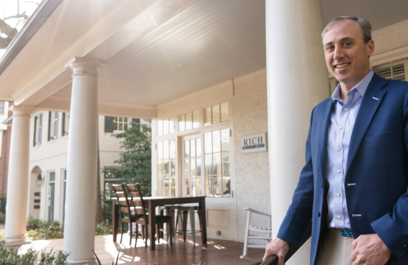 Marshall Rich stands in front of Rich Realty Group's offices in Five Points, Raleigh, NC